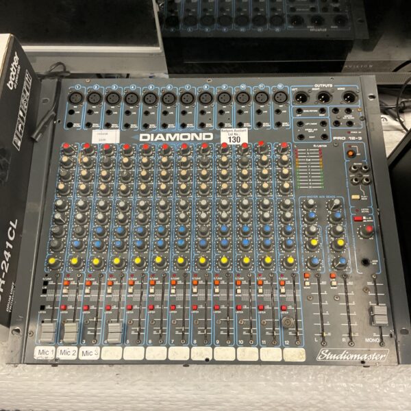 Vintage Studiomaster Diamond Pro 12-3 analog mixing console with channel strips.