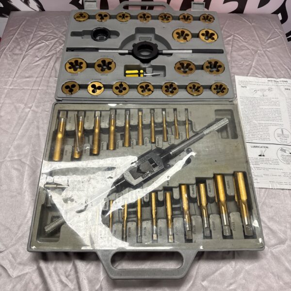 Vintage tap and die set with various threading tools in a case.