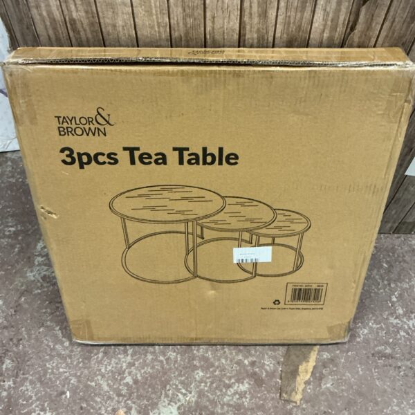Taylor and Brown three-piece nesting tea table set in a living room.