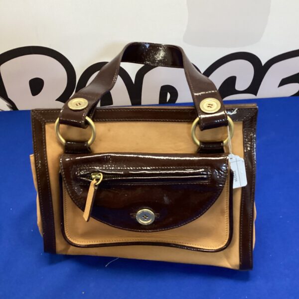 Front view of a Ted Baker leather handbag.
