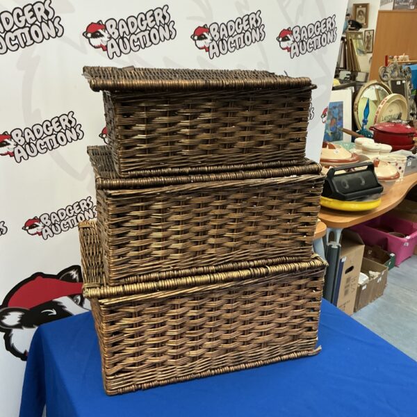 Three vintage wicker picnic baskets in a lot.