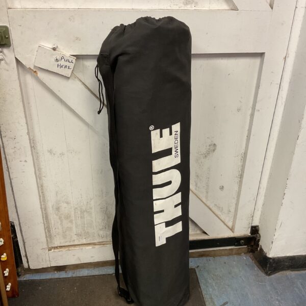 Black Thule Ranger 90 roof box, car roof storage solution.