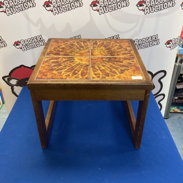 Vintage tile top side table with patterned tile surface.