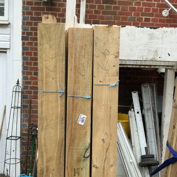 Stacked timber bundles ready for construction or DIY projects.