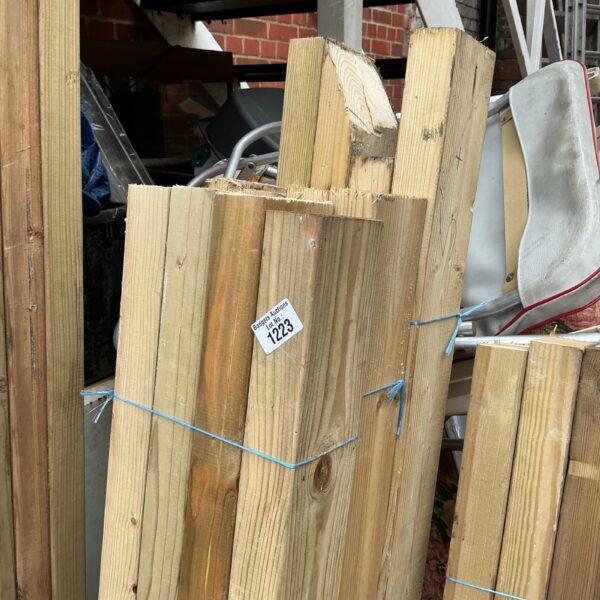 Strapped bundles of timber ready for construction projects.