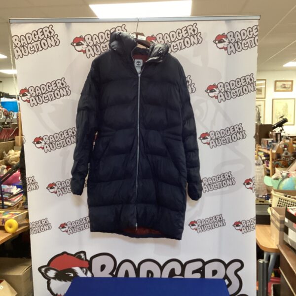 Ladies’ Timberland puffer coat, a warm winter jacket for outdoor wear.