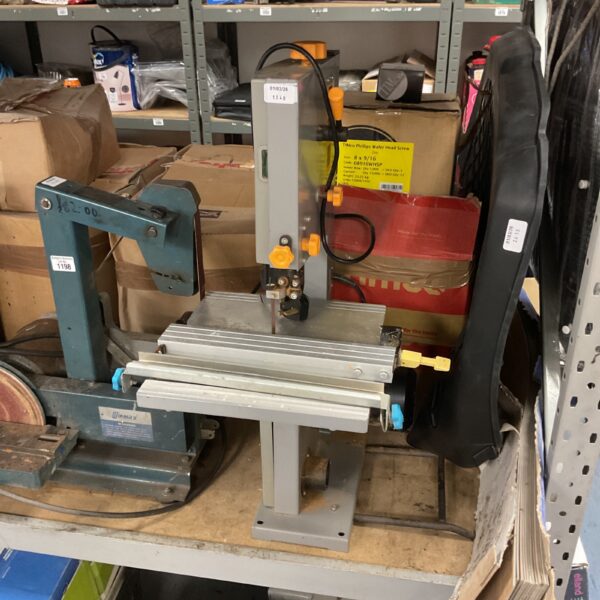 Vintage Titan bandsaw in a workshop setting.