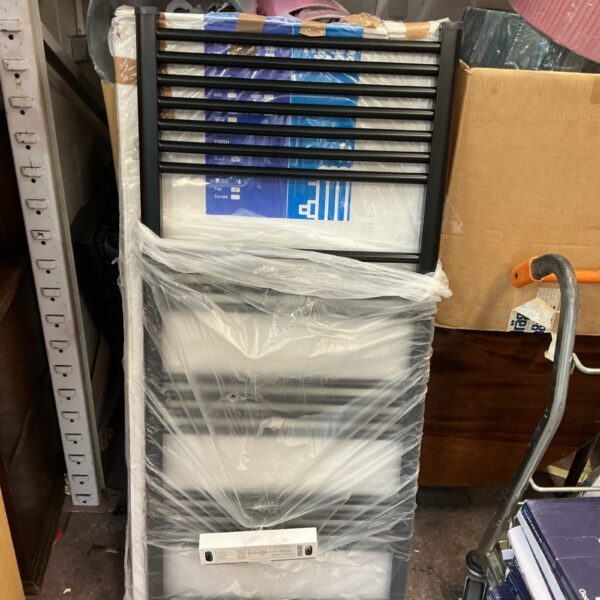 Black Trade Taps ladder radiator in packaging.