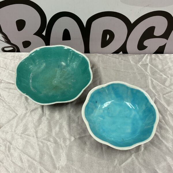 Vibrant turquoise Chinese ceramic bowl with petal rim.