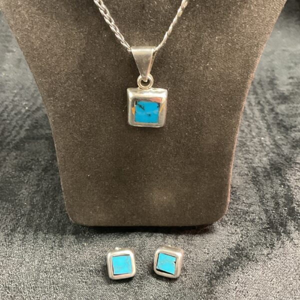 Vintage turquoise and silver necklace with matching earrings.