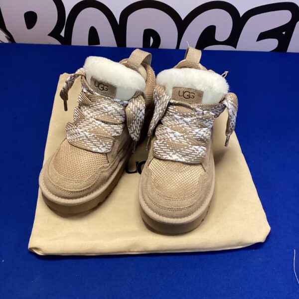Tan suede Ugg boots size 6.5, stylish women's footwear.