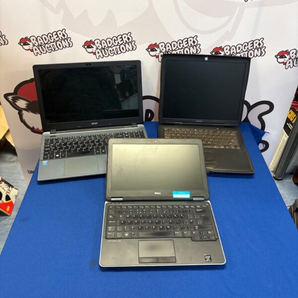 Lot of three used laptops including Dell, Apple, and Acer.