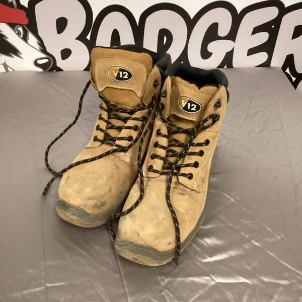 Size 11 V12 safety boots showing wear and tear.