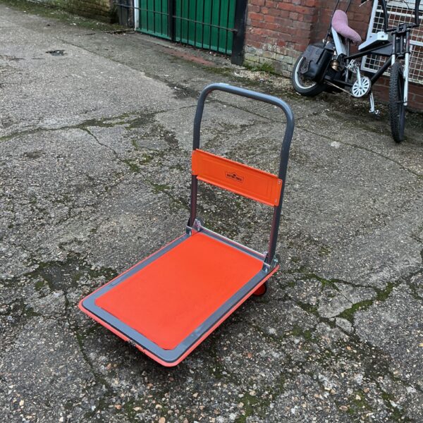 Red Victor Tools folding trolley for workshop and garage use.