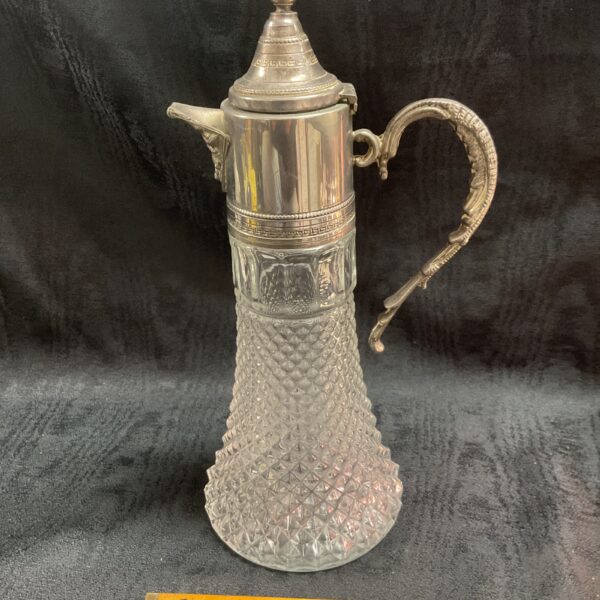 Antique Victorian Claret Jug with whitemetal mount and faceted glass.