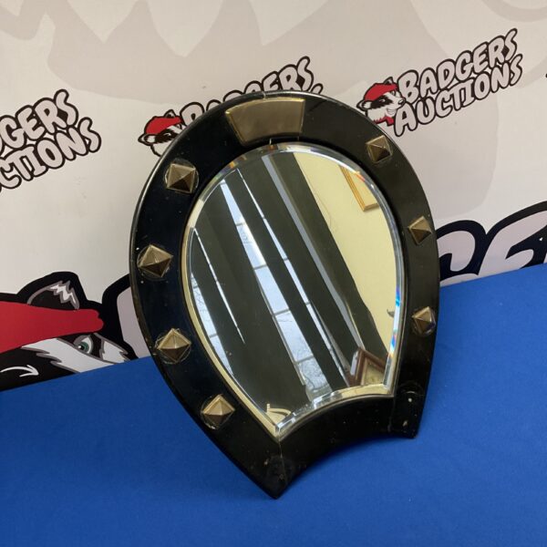 Antique Victorian studded dressing table mirror with horseshoe shape.