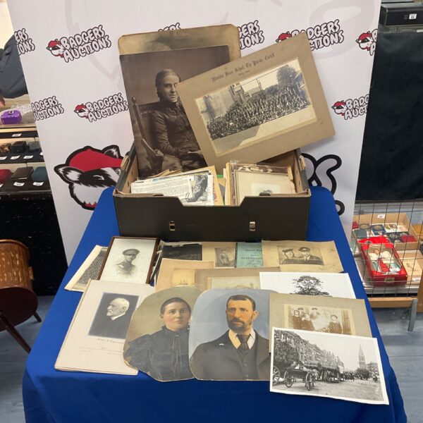 Victorian and wartime ephemera collection with vintage photographs and newspaper clippings.