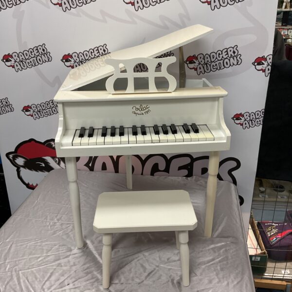 Vintage Vilac grand piano with stool, a charming wooden toy.