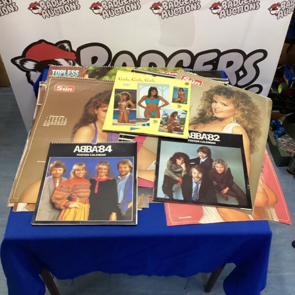 Vintage 1990s adult calendars featuring Page 3 and The Sun imagery.