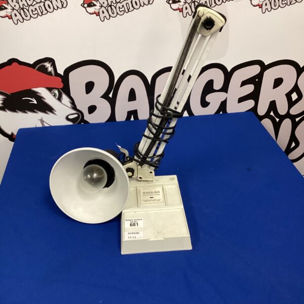 Vintage anglepoise desk lamp with adjustable arm and conical shade.