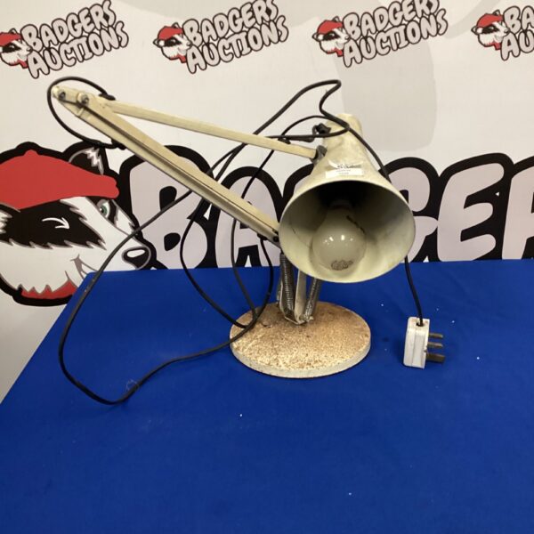 Vintage Anglepoise desk lamp with adjustable arm and weighted base.