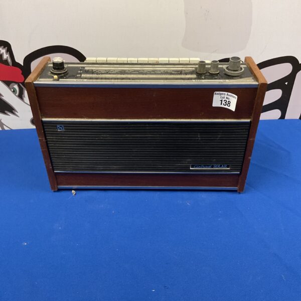 Vintage RRR Astrad F6TR17-R103 transistor radio in brown case.