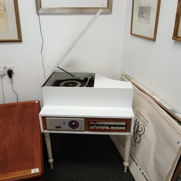 Vintage baby grand hifi system with turntable and amplifier.