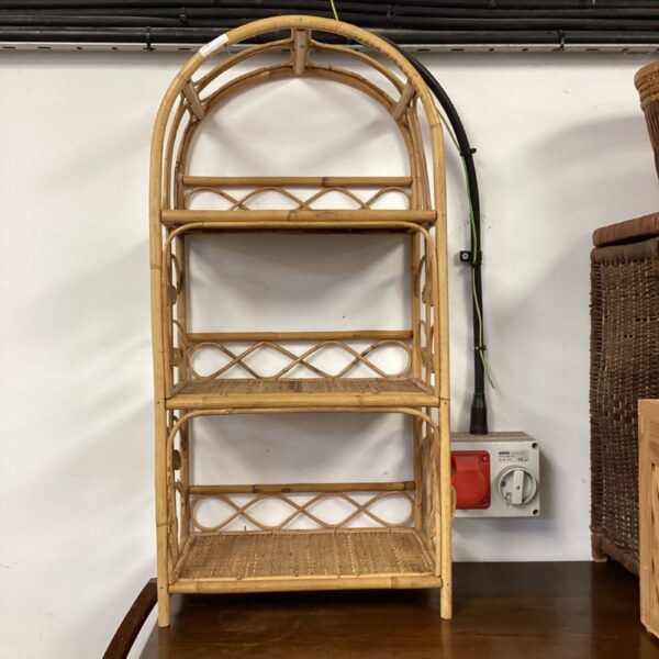 Vintage bamboo shelving unit with three shelves, retro style.