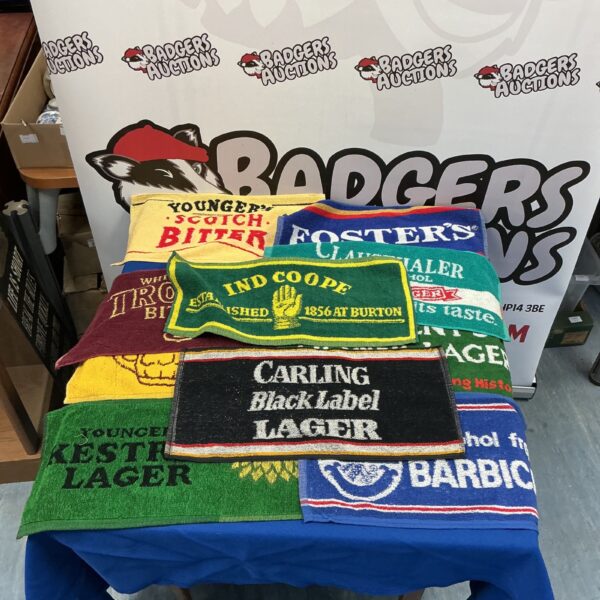 Vintage bar towels collection featuring brewery advertising.