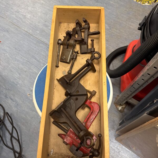 Lot of four vintage bench clamps for woodworking projects.