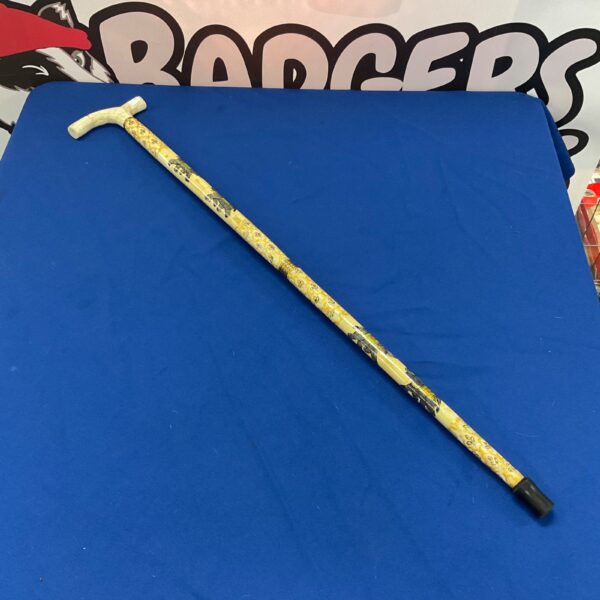 Vintage bone walking stick with hand painted floral handle.