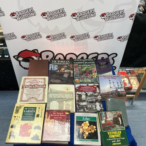 Stack of vintage books including railway and garden titles.