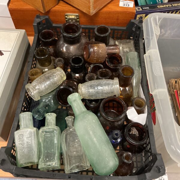 Assortment of colourful vintage bottles, antique glass collection.