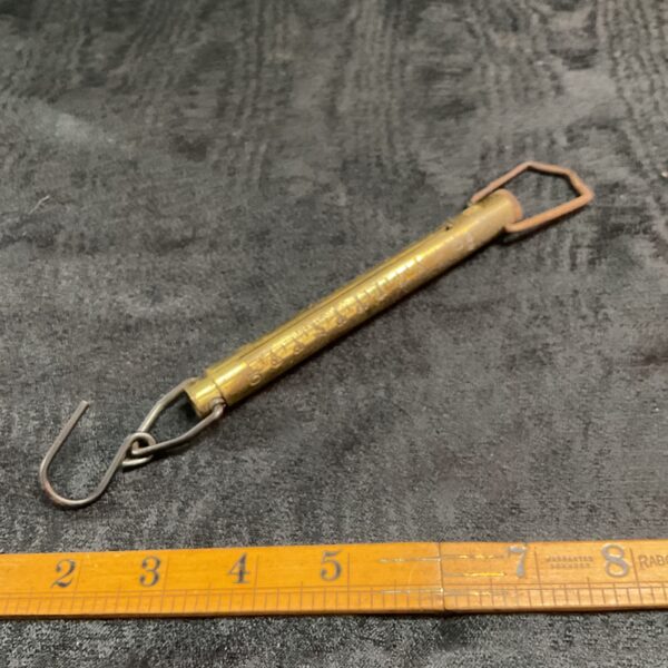 Vintage brass troy ounce scales for weighing precious metals.