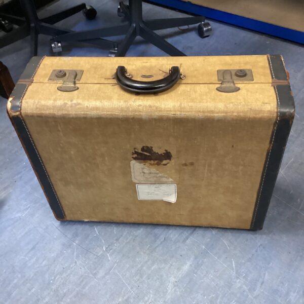 Vintage brown suitcase with a single handle, ideal for collectors.