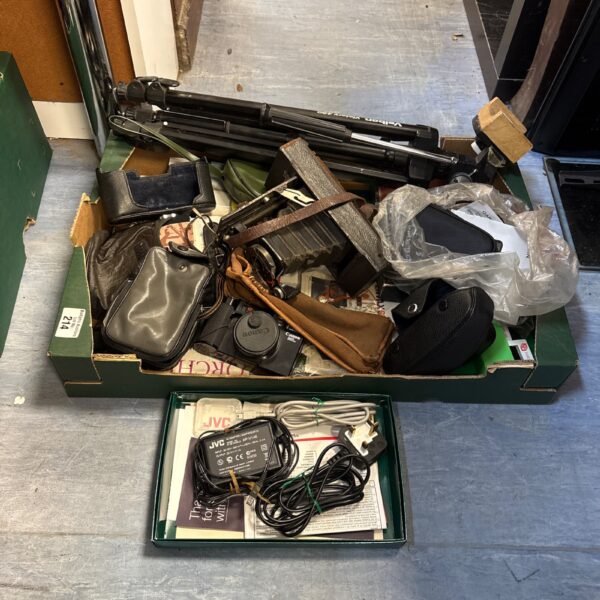 Vintage camera lot with tripod and cases for collectors.