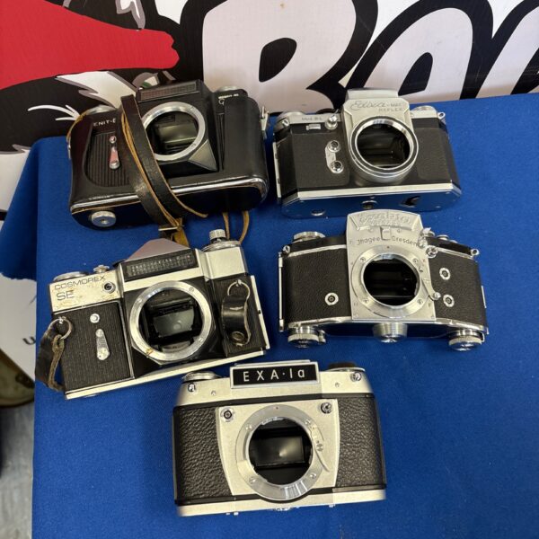 Vintage camera lot featuring an Enit model, antique collectible.