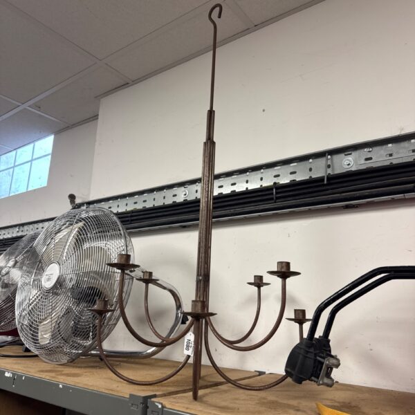 Ornate vintage brass candle chandelier with multiple arms.