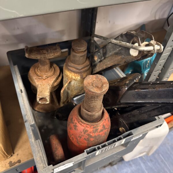 Selection of vintage car jacks for classic car restoration.