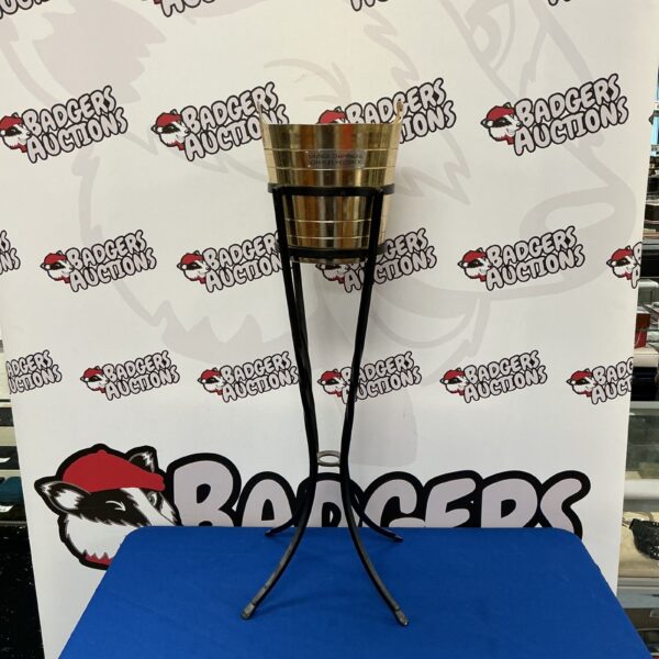 Vintage Charles Heidsieck champagne ice bucket on wrought iron stand.