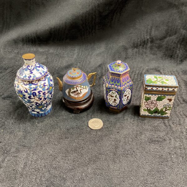 Blue and white floral vintage cloisonne pot with detailed enamel work.