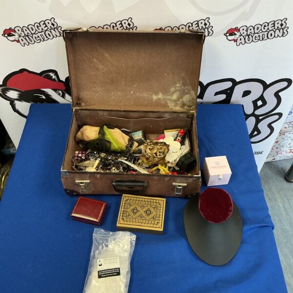Vintage costume jewellery lot with trinket box displayed open.