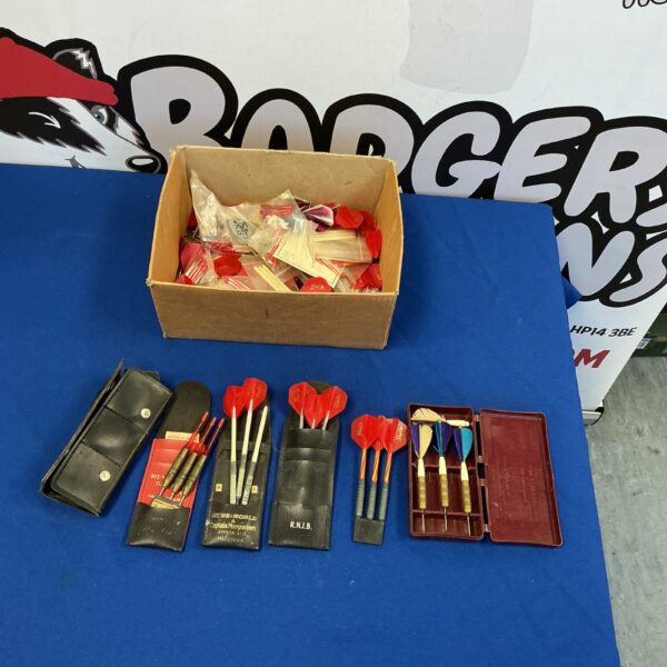 Vintage dart sets with original packaging and leather case.
