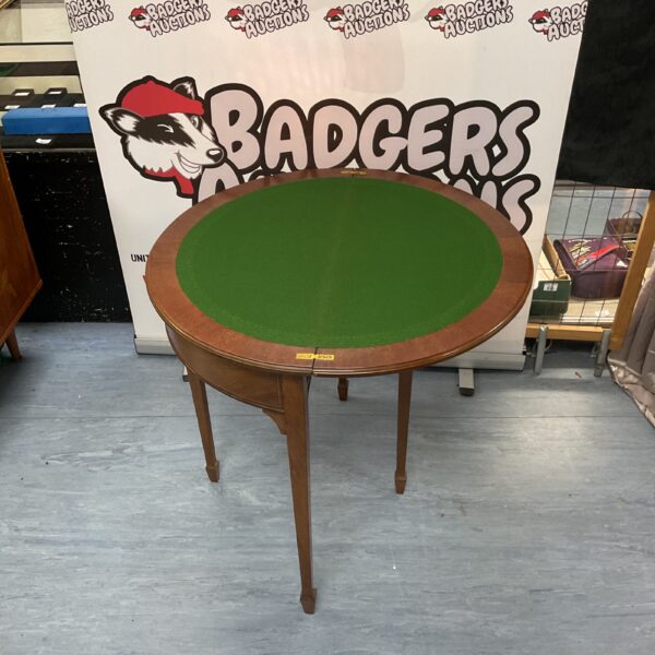 Vintage Demi-Loon card table with green felt surface.