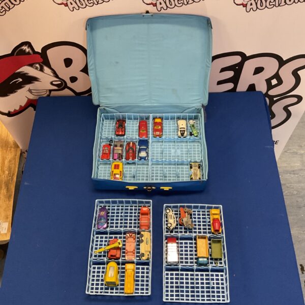 Vintage diecast model car collection in blue case.