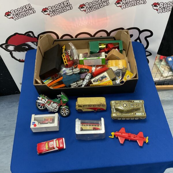Overview of a vintage diecast toy lot with various models.
