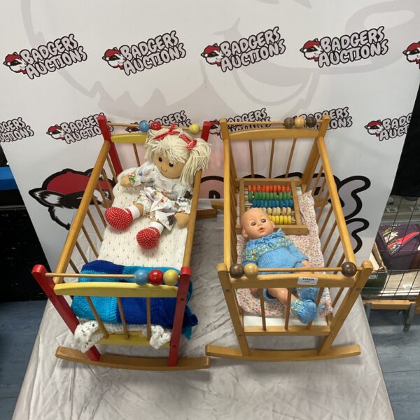 Vintage doll cribs with dolls, antique nursery toys.