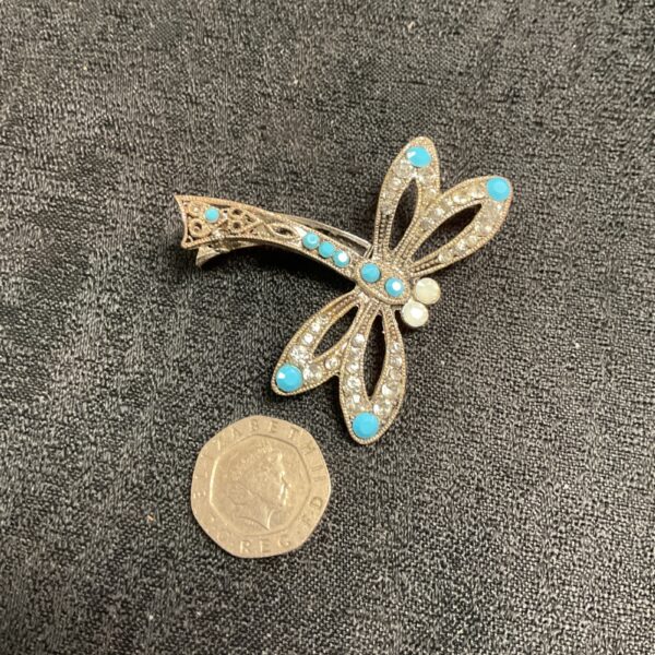 Sparkling vintage 1950s dragonfly brooch with blue enamel.