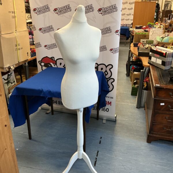 Vintage wooden dressmaker manikin for clothing display.