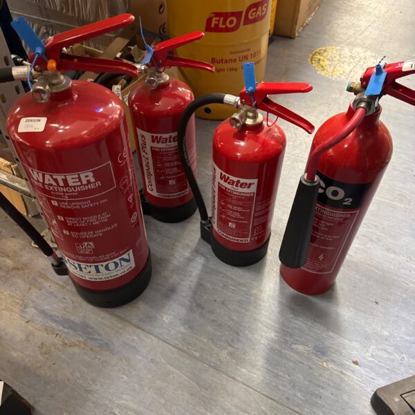 Lot of four vintage fire extinguishers for collectors.